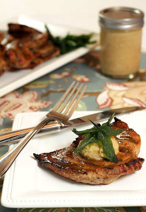 Pork steak with a rum, molasses and mustard glaze with savory apple butter and fried sage leaves